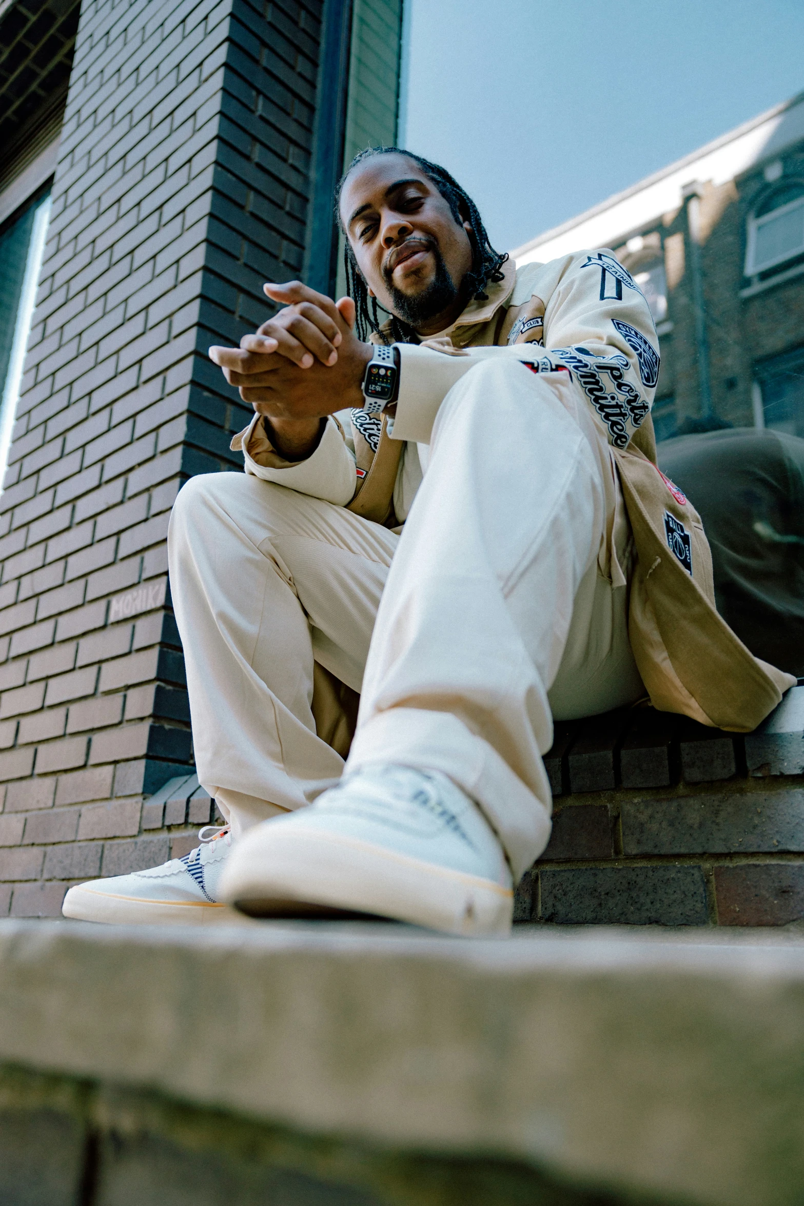 a person sitting down on a stone steps