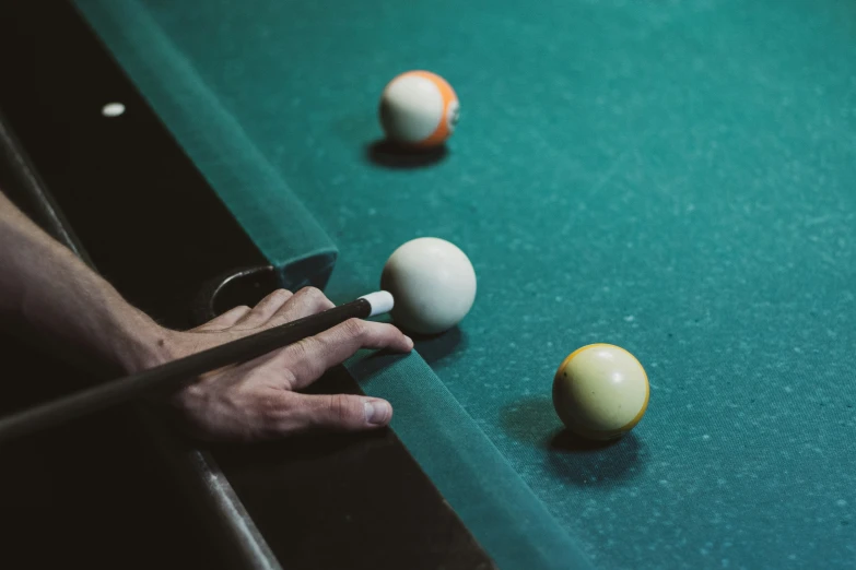 billiards on the table with cues and balls
