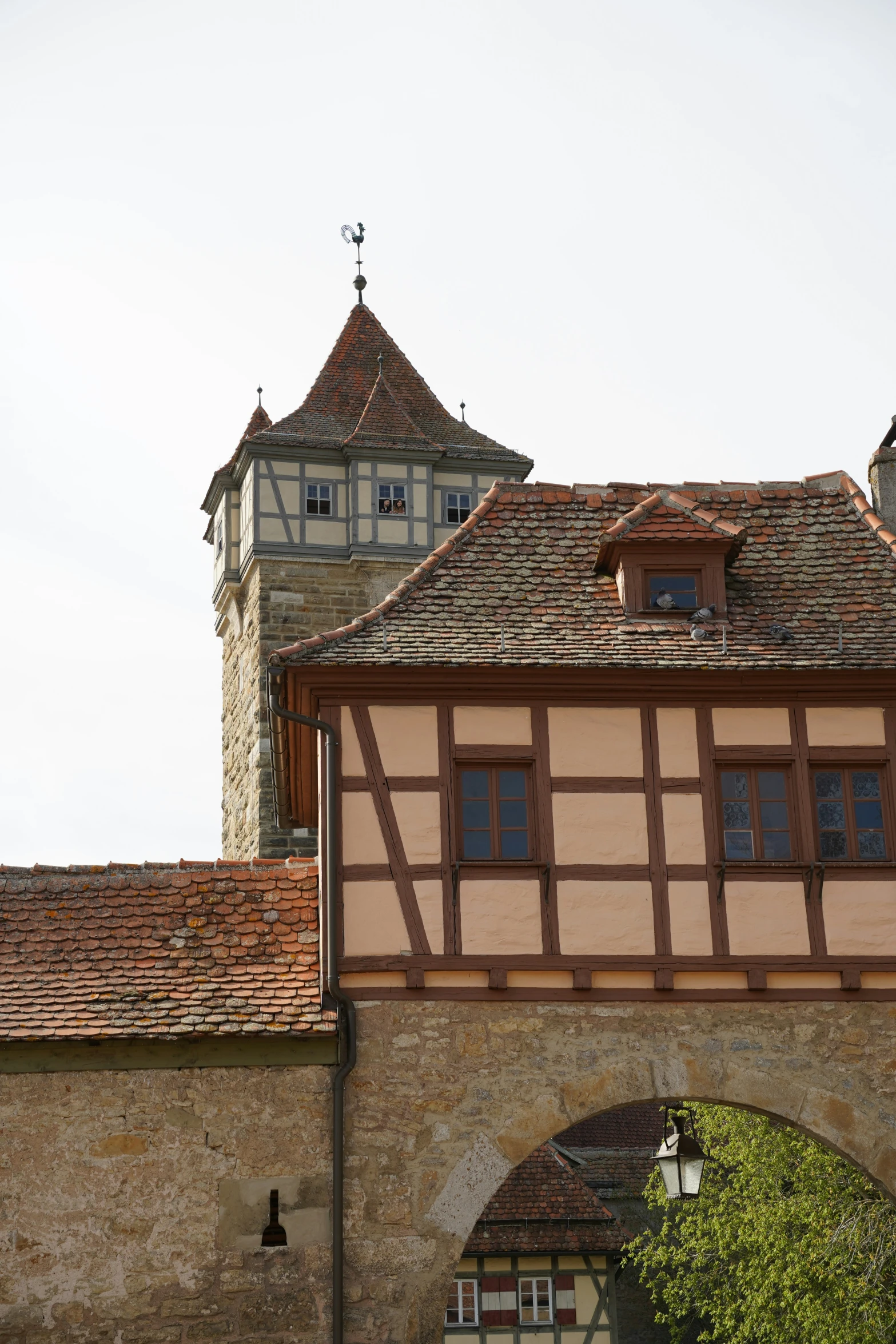 a clock tower is over the entrance to an old building