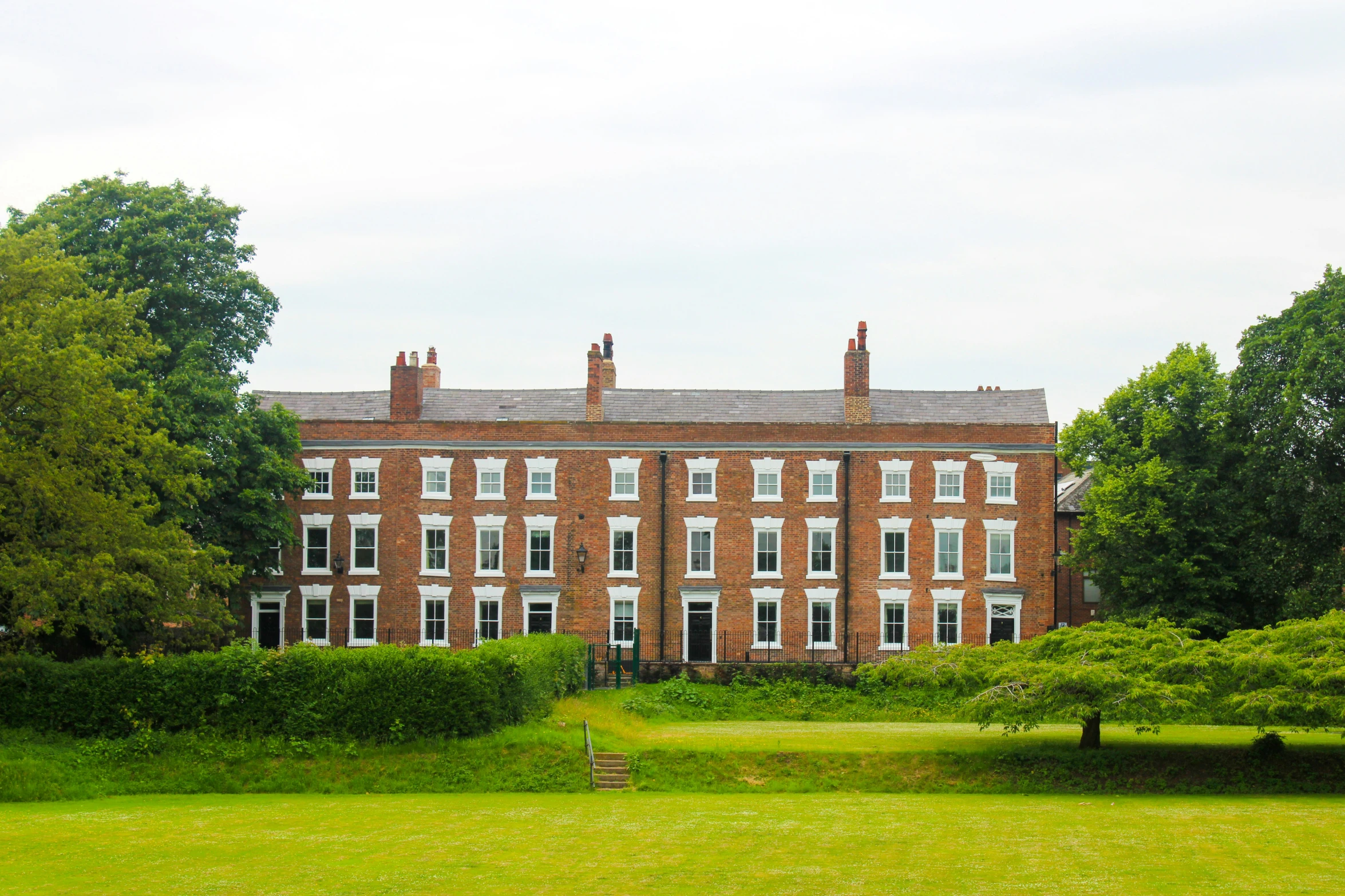 a view of a big building out across the field