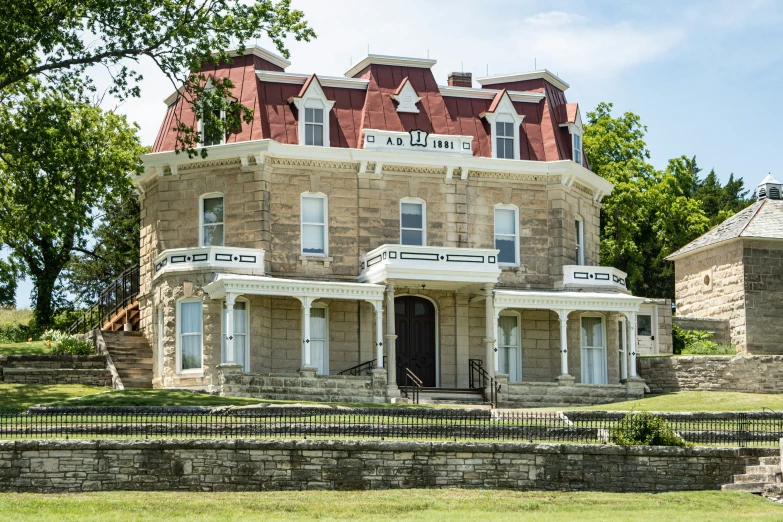 a large brown building sitting in the grass