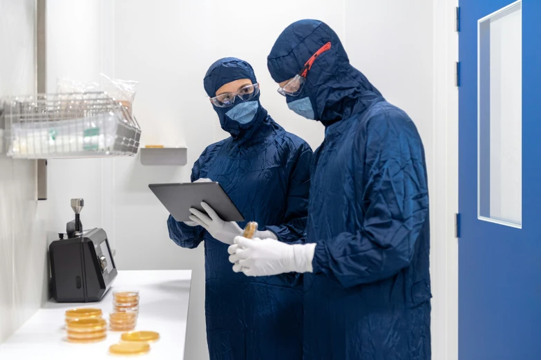 two surgeons working on a project in a doctors room