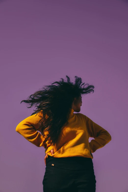 a woman with her hair fluttering in the wind