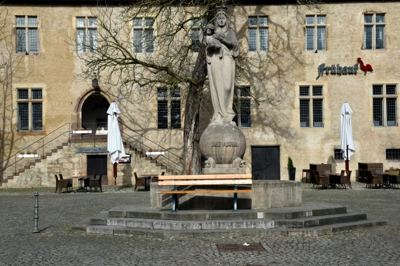 the large building is located in the courtyard with stairs to it