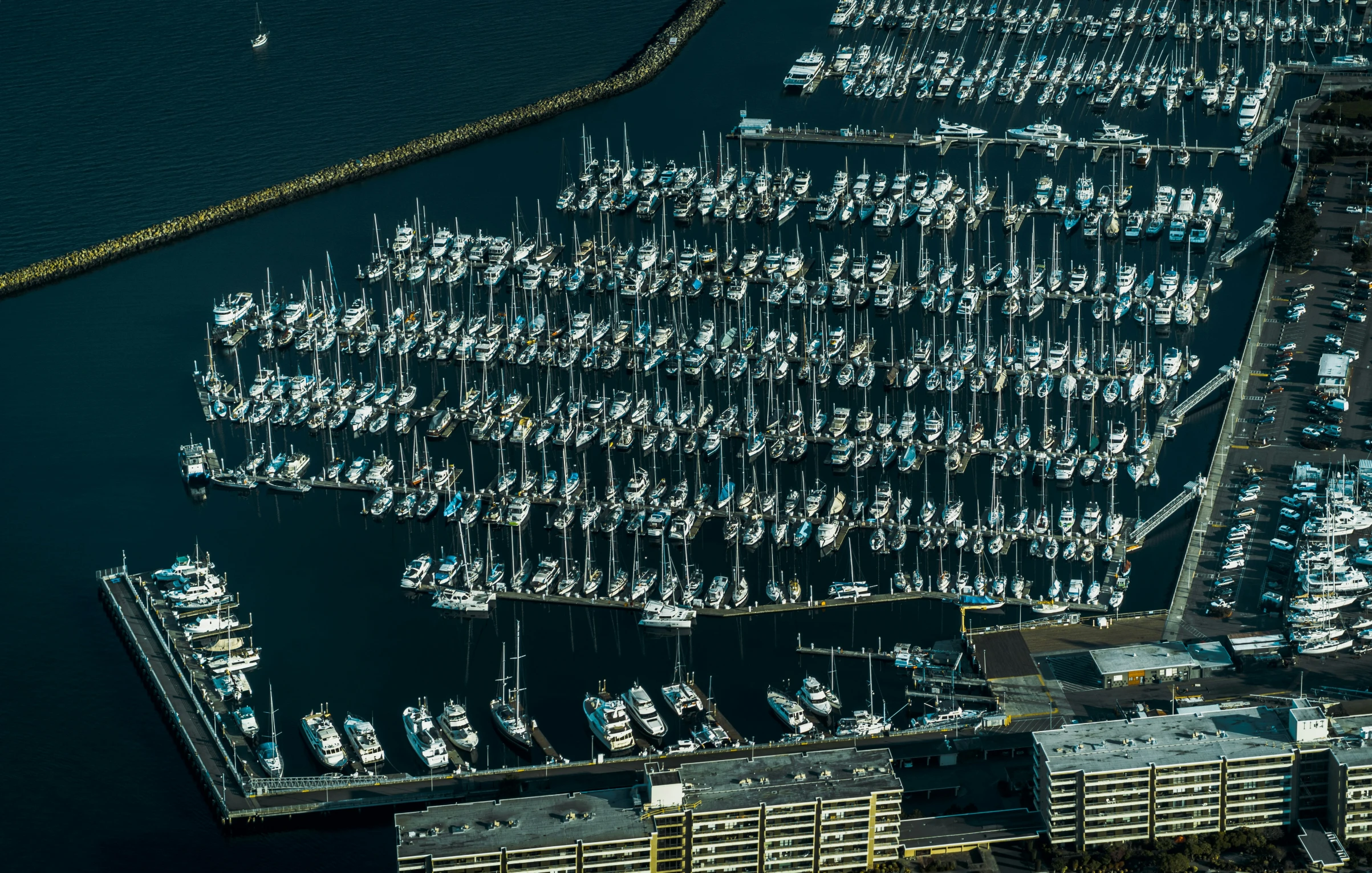 the sail boats are docked on the marina