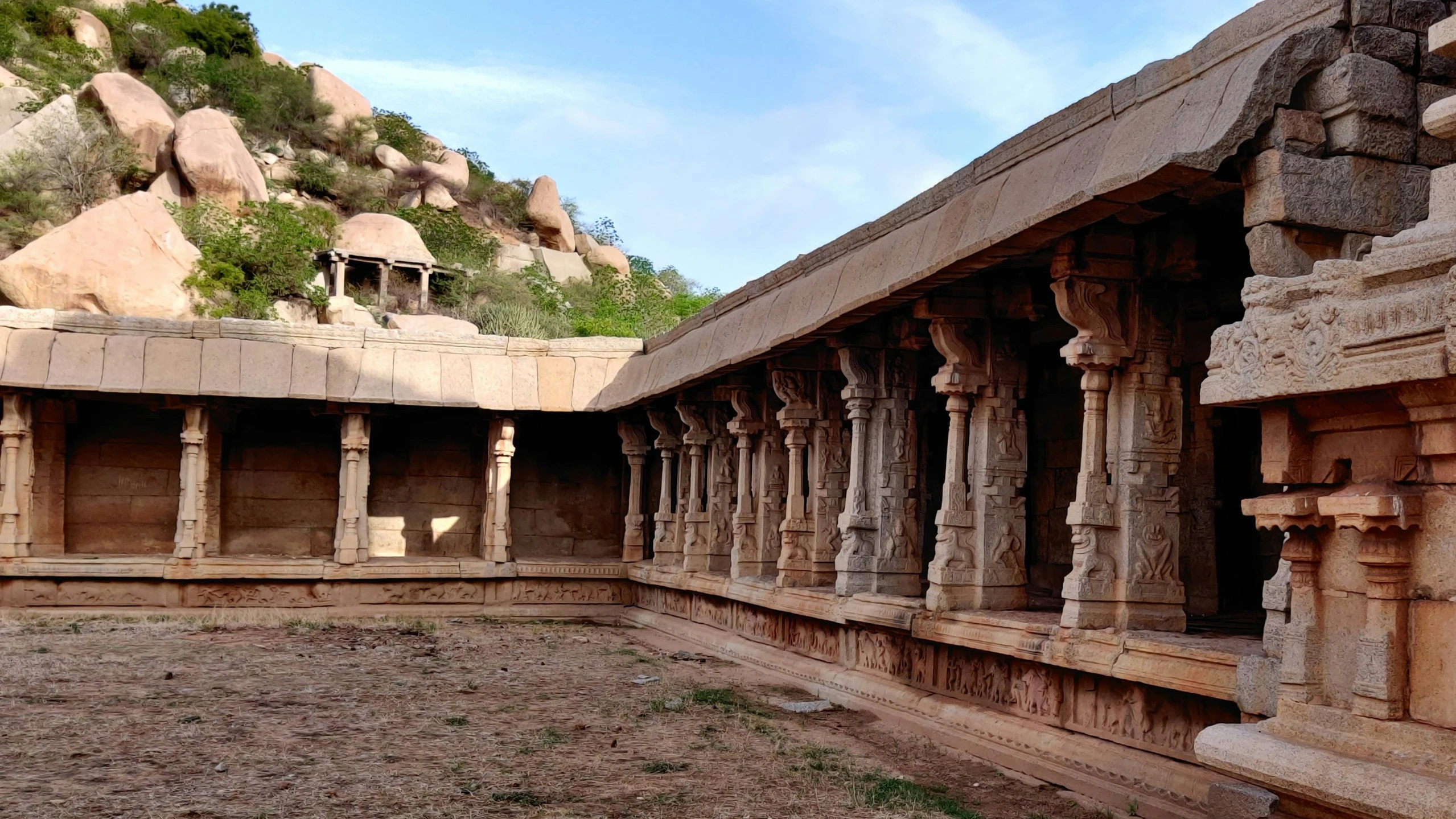 the inside of an ancient temple with stone pillars