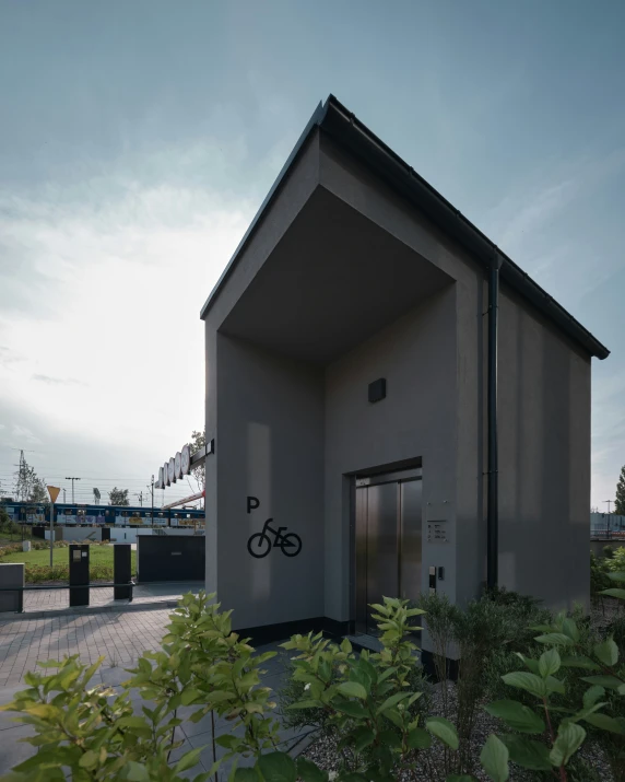 small house with door and bicycle parked next to it