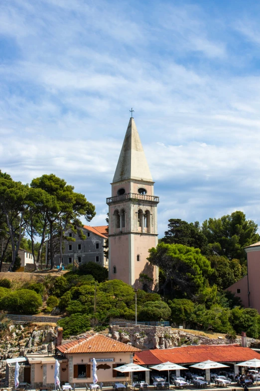 an old church sits on top of a hill