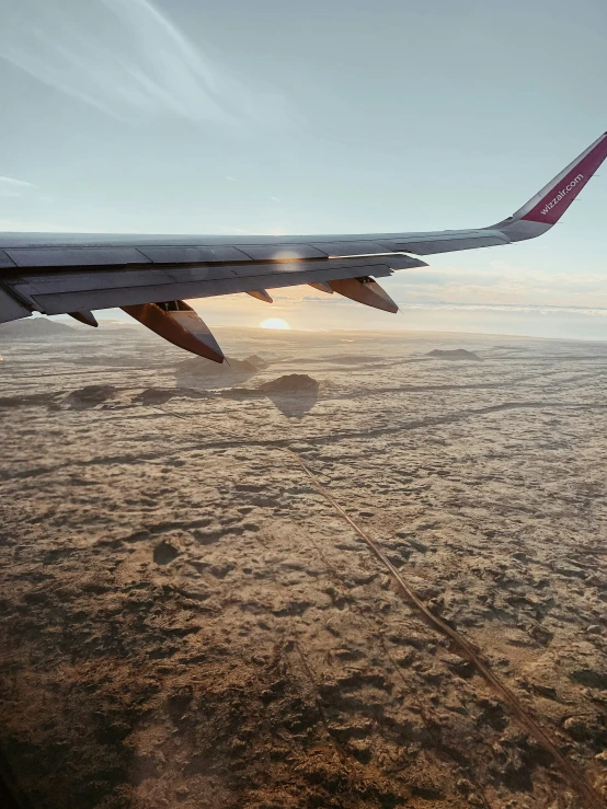 an airplane wing flying through the air