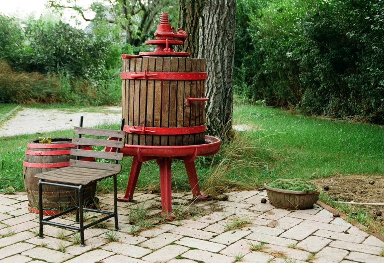 a small table and chairs are set up in front of a wine cooler
