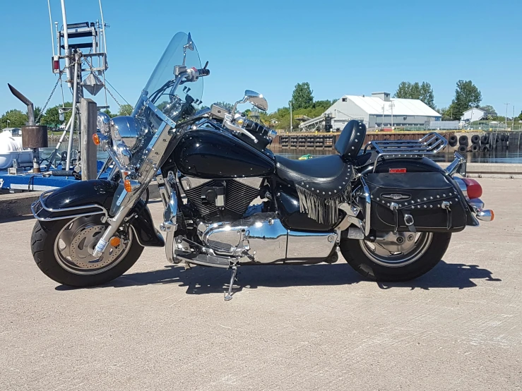 motorcycle parked in lot with a blue sky in the background