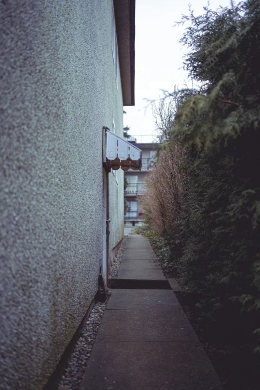 a long pathway in front of some buildings