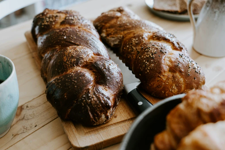 a  board with two loaves of bread on top of it