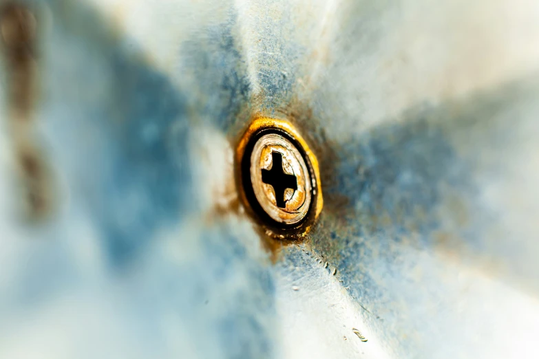 a close - up view of a water drop with a cross in the middle