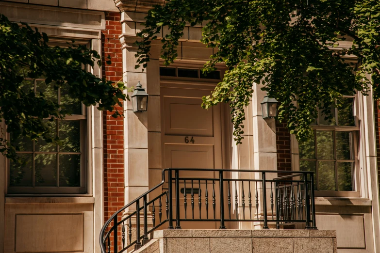 stairs leading up to two large brick houses