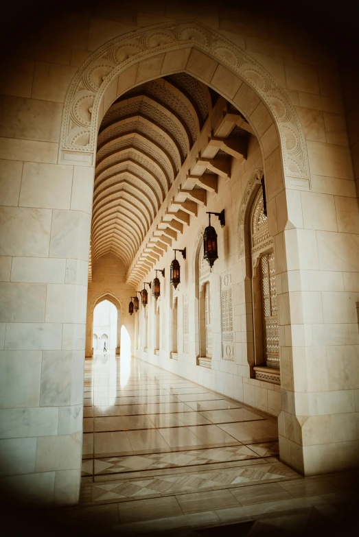 a hallway with arches and lanterns and lighting