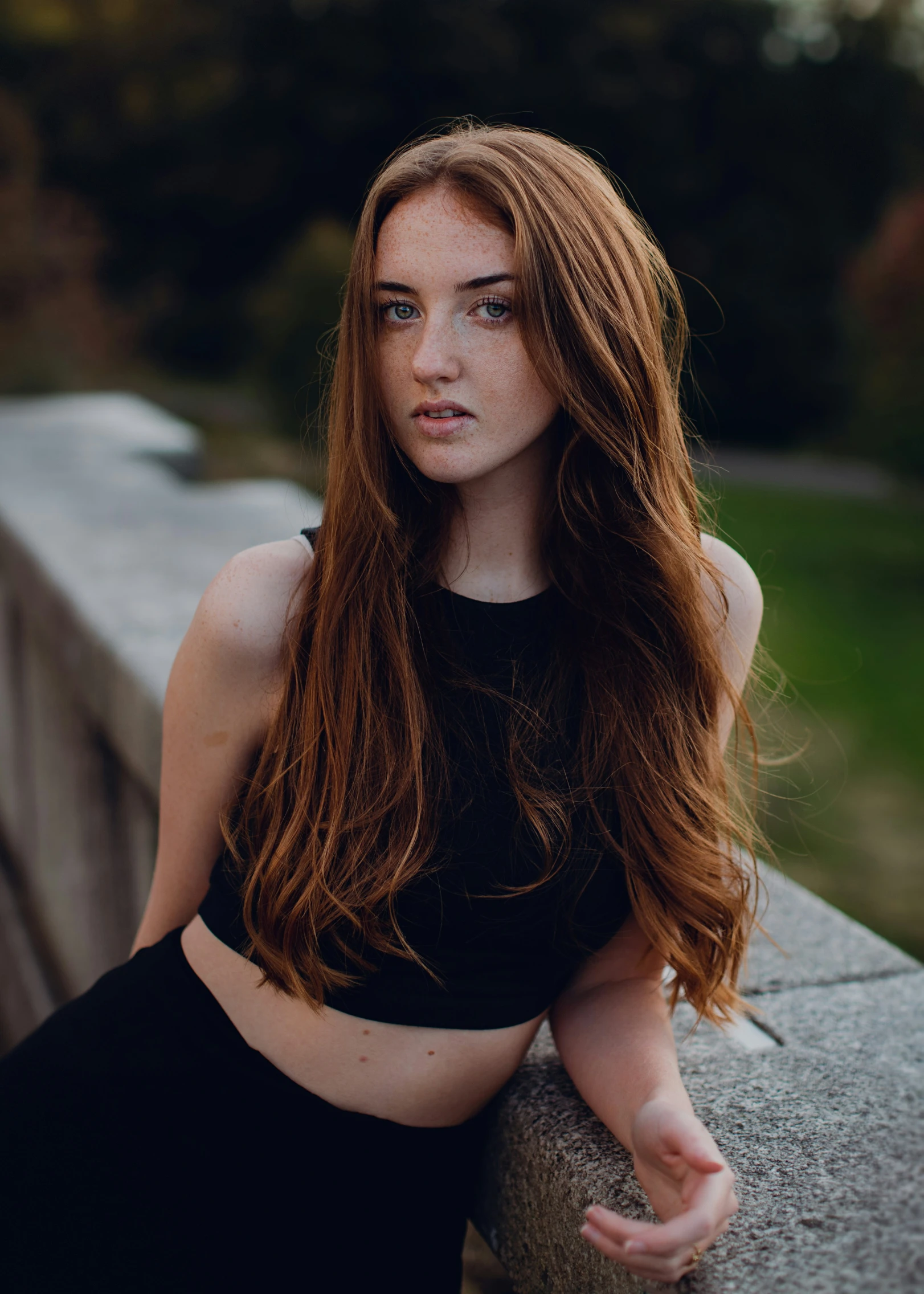 a pretty young woman posing with long hair