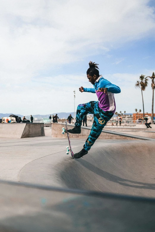 a person riding a skateboard on top of a ramp