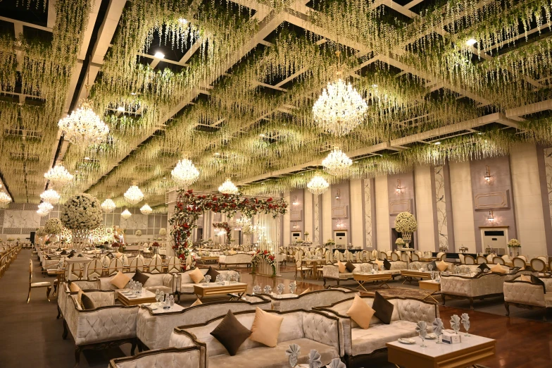 the inside of an elegant banquet hall has many tables and chairs