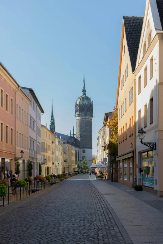 a narrow street with buildings lining both sides