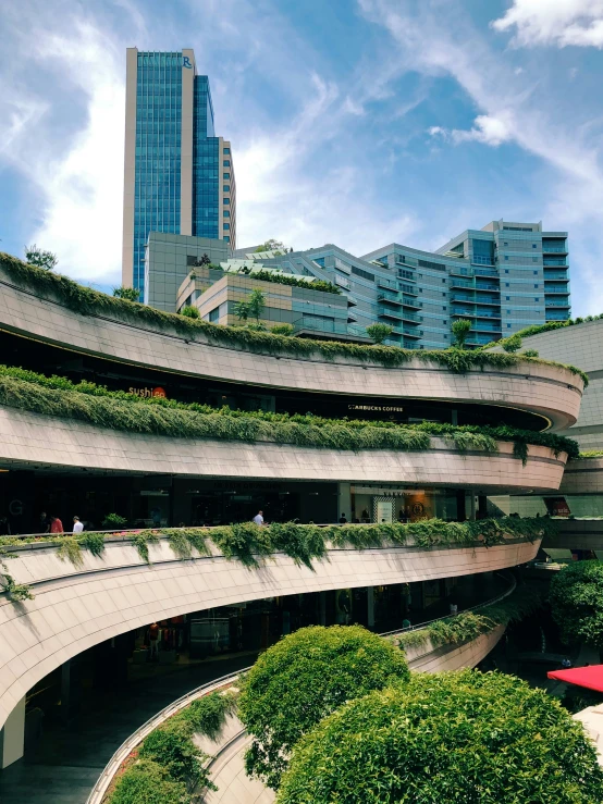 an unusual building with plants growing on it