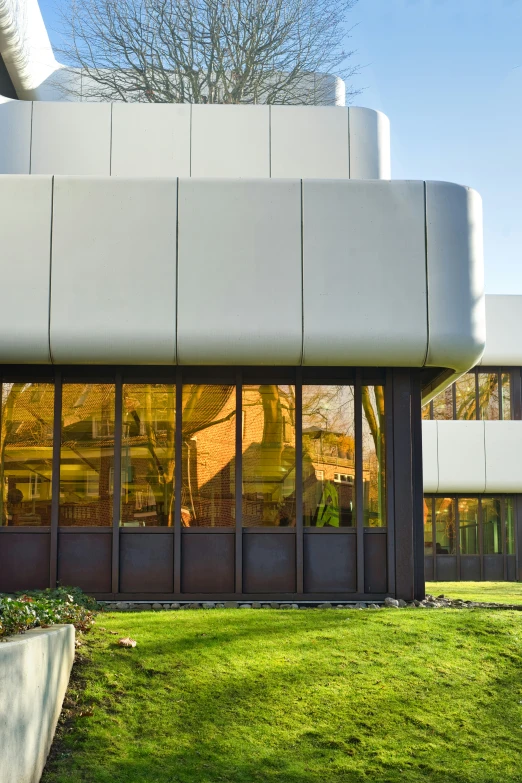 the outside of an office building with a window reflection