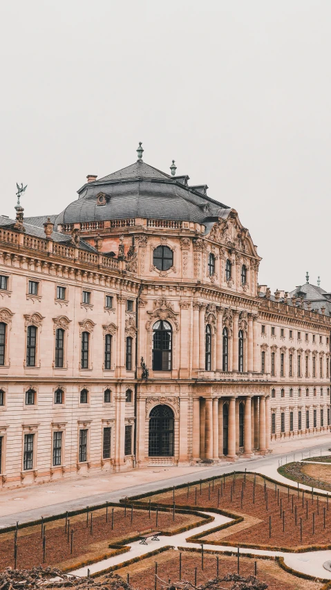 an old building with ornate architecture next to grass