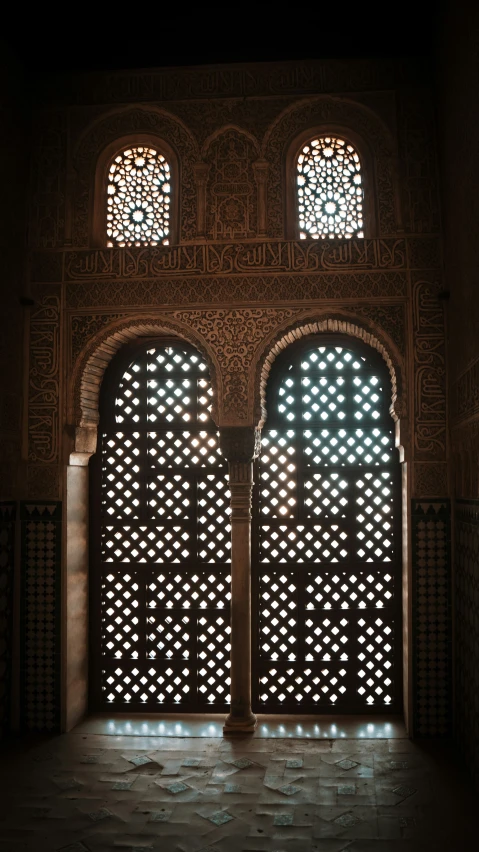 the inside doors to an ornate building with stained glass windows