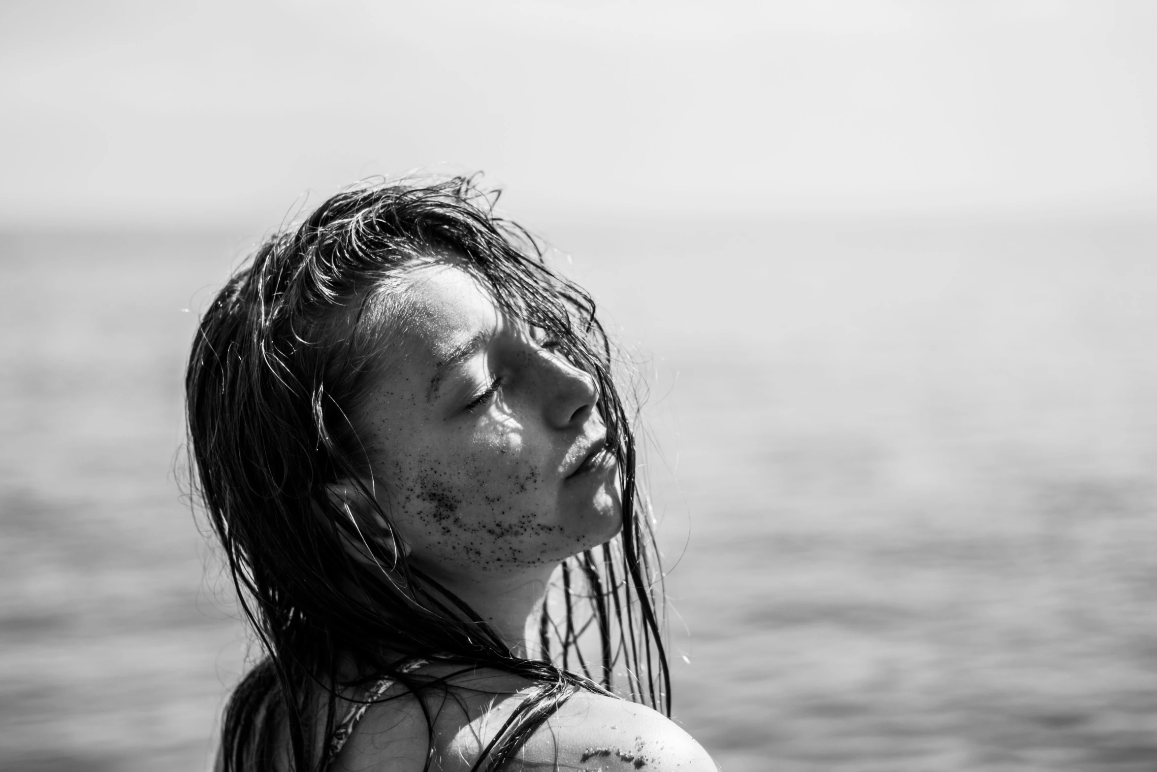 a black and white po of a man with his wet head