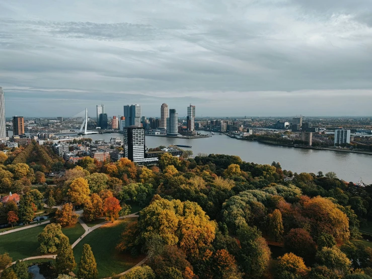 the city is shown in autumn on this cloudy day