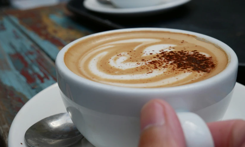 a  chocolate coffee with a swirl in it