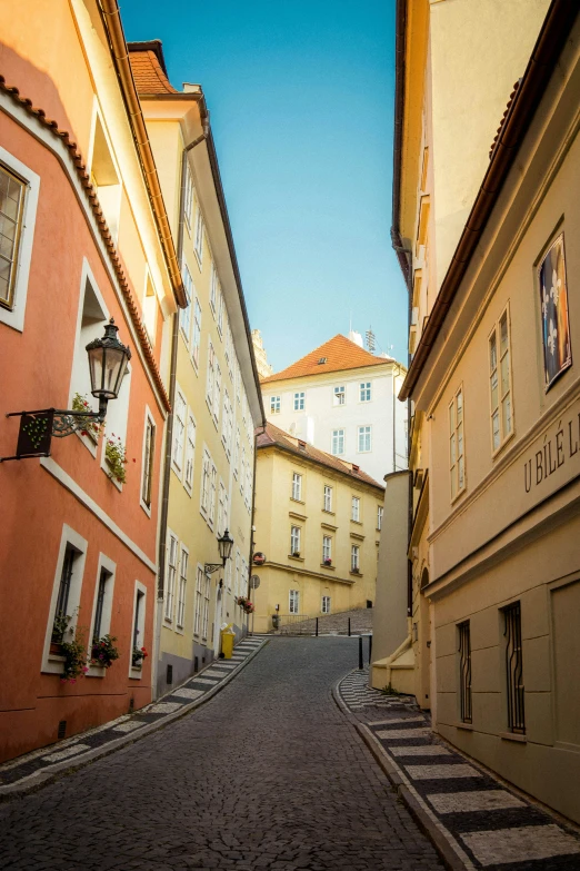 an empty city street that is lined with buildings