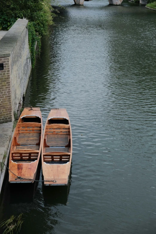 two boats are parked by the water side