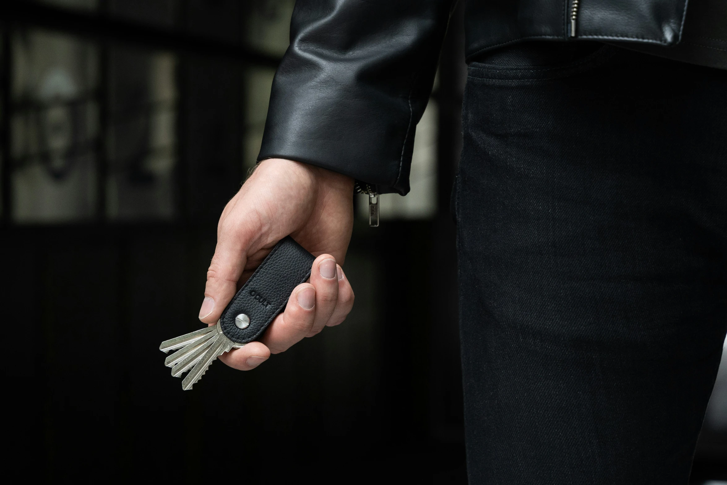 a person holding a key in their hand