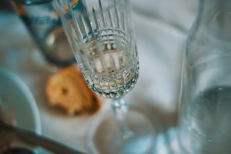 two wine glasses sitting on top of a counter