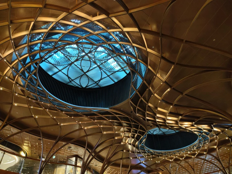 this is a beautiful indoor area with wooden railings and metal poles