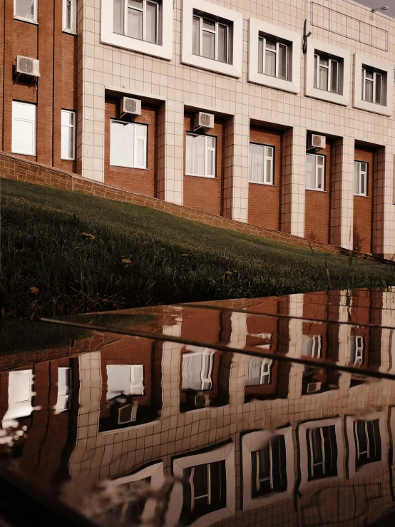 an image of a building reflecting in water