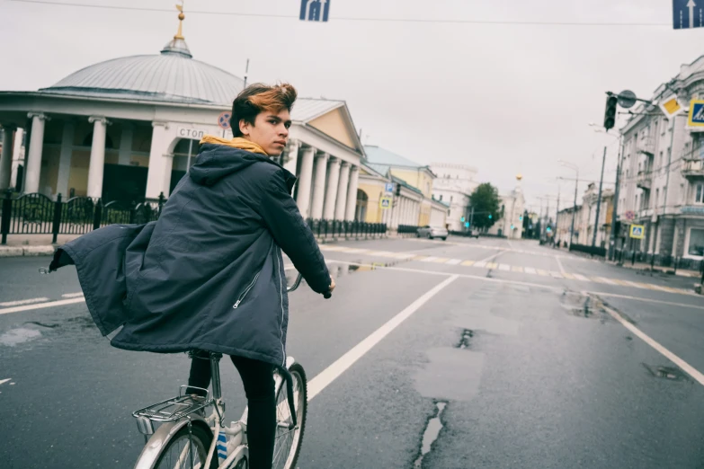 a person is riding a bike down the street