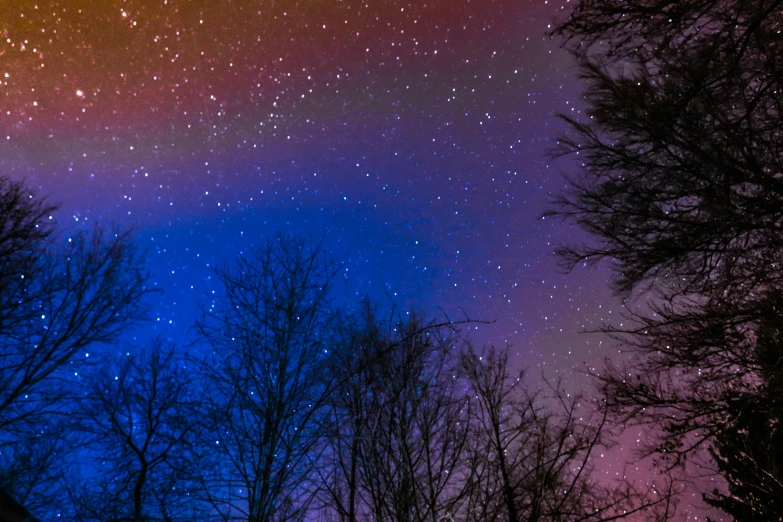 a night sky with stars and the moon