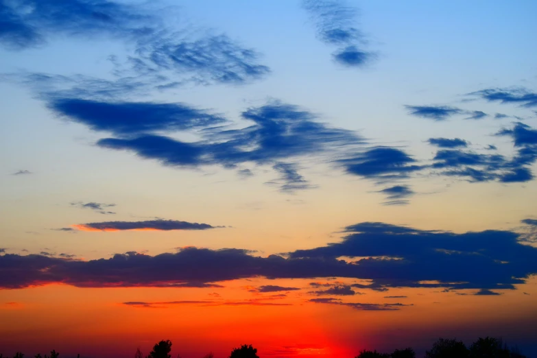 an orange and blue sky is seen in this image