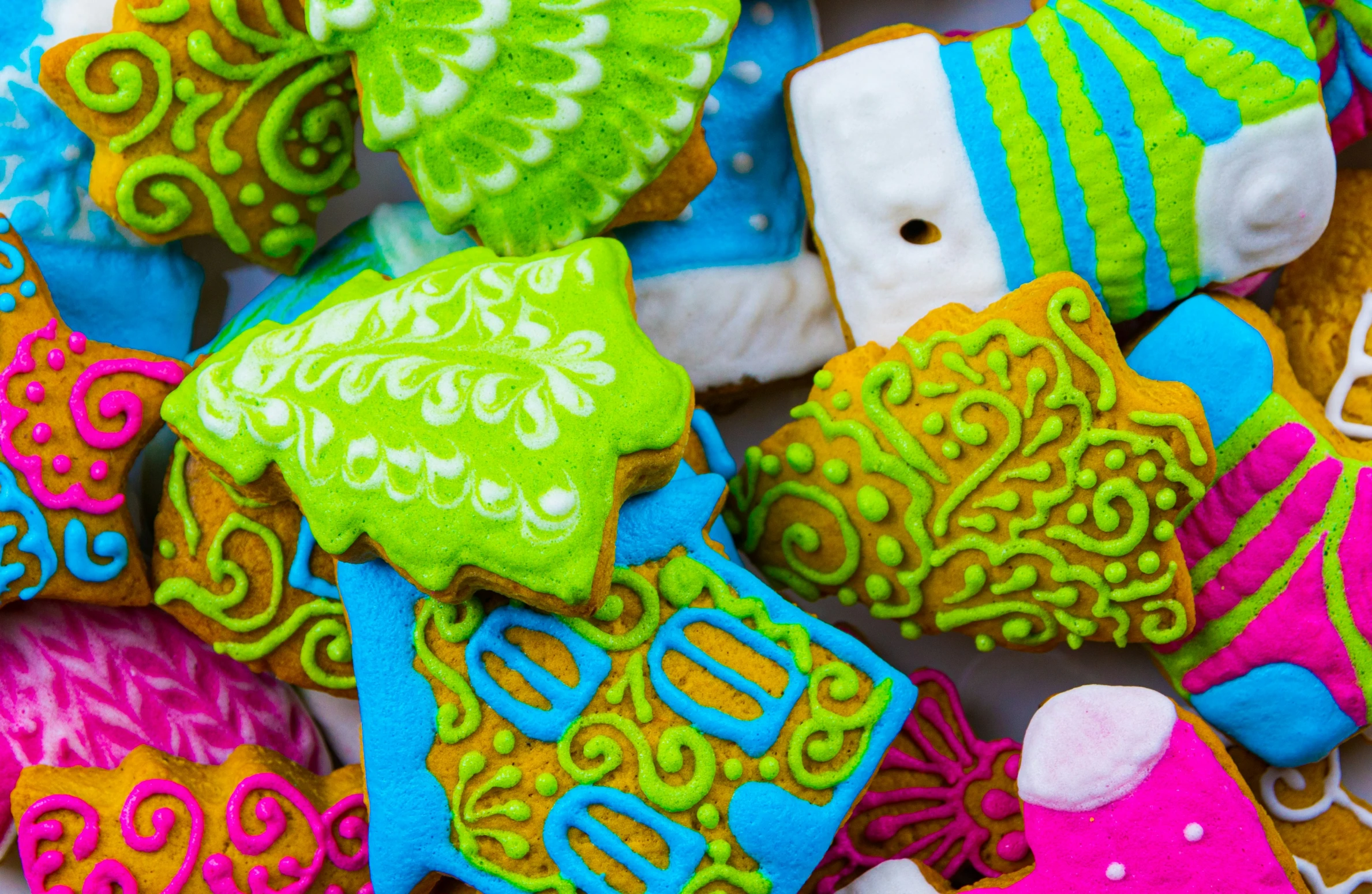 brightly colored cookie cookies sitting in a pile