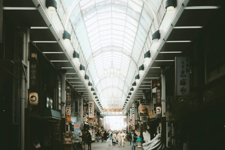 a building with lots of people walking through it