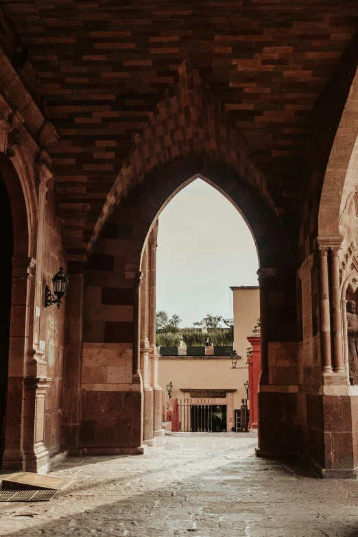 view of a brick walkway, entrance area and building from outside