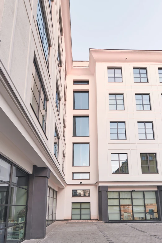 the entrance to an apartment building next to the street