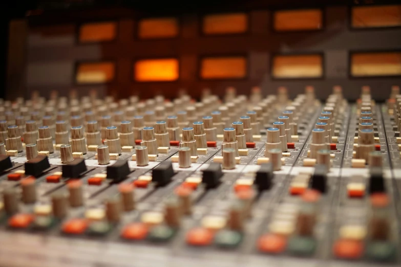 a sound board with many bottles on the side of it