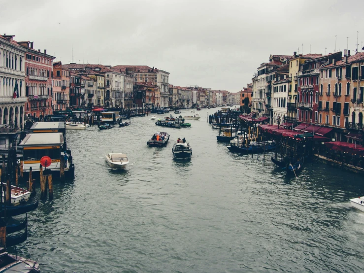 a street full of boats moving down it's sides