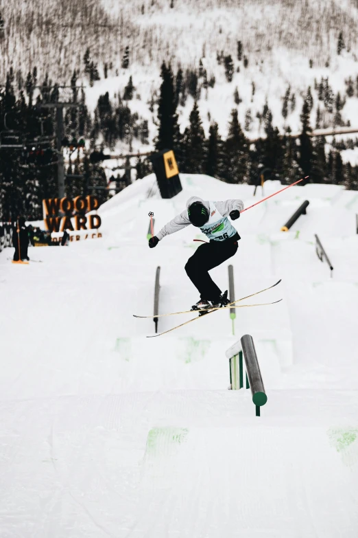 a skier jumps into the air after skiing