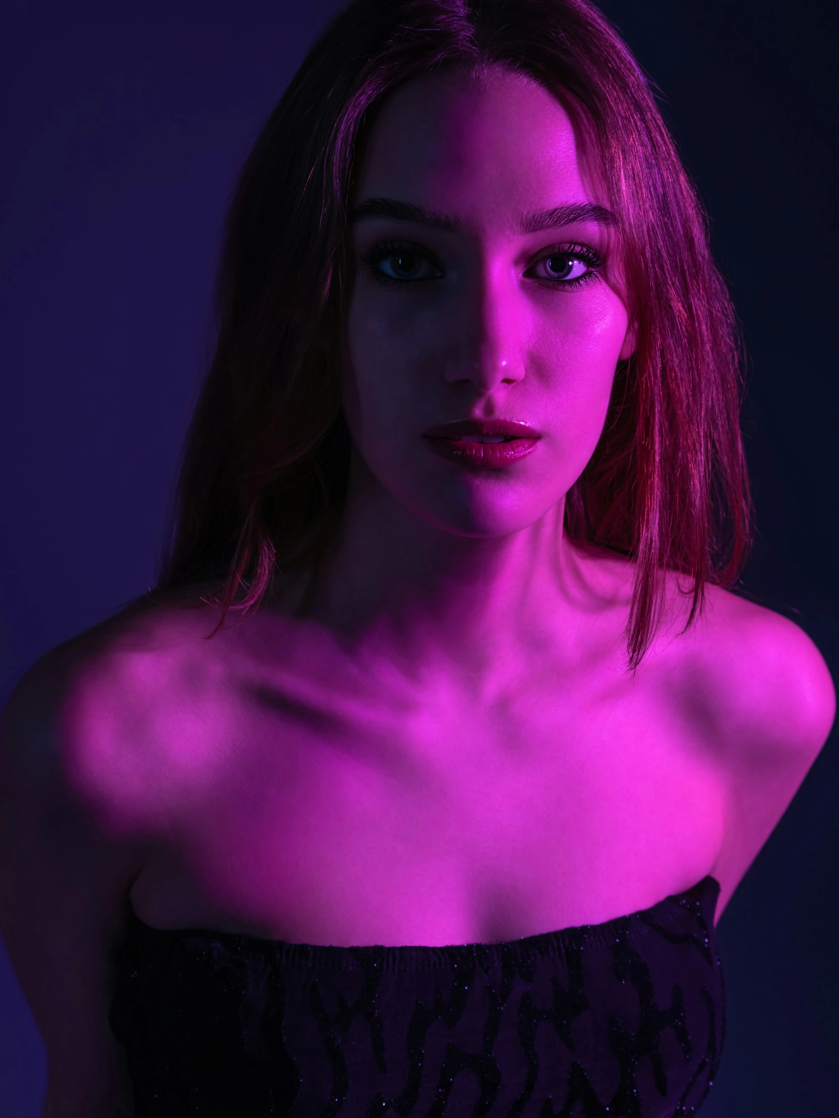 a beautiful woman in black dress against a purple background