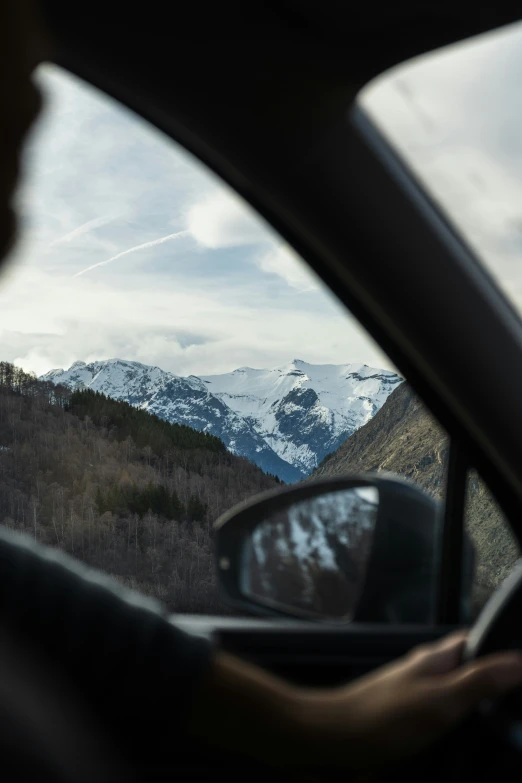 view of the mountains through a car window