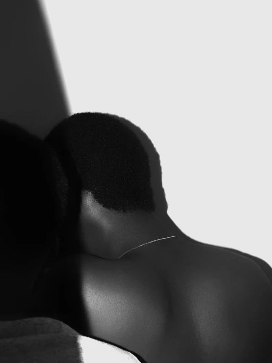 a woman's black silhouette showing her back with skin pigment